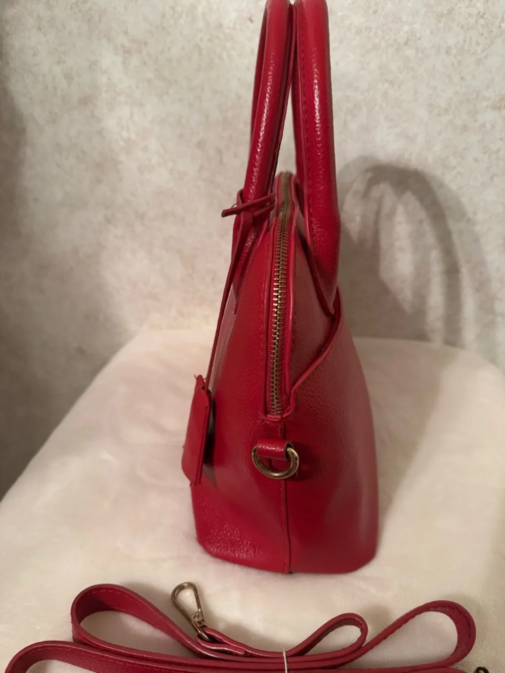 bebe Red Pebbled Fabiola Leather Satchel with Gold Logo Accent with strap.